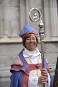 Eva Brunne - out gay, civil partnered, a mother and a Bishop - holding the Stolkholm Crozier after her consecration in 2009